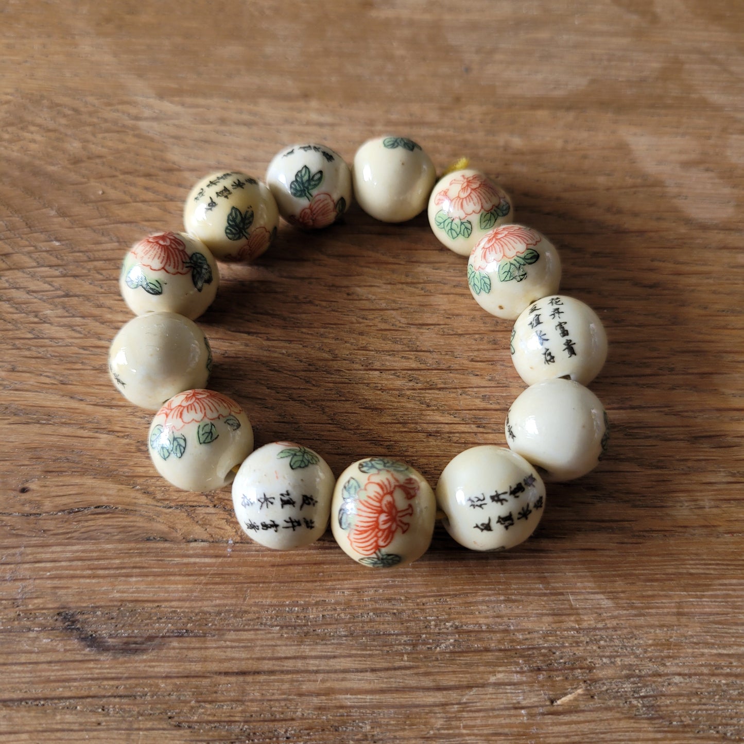Vintage Chinese-style ceramic bead bracelet with floral motif and calligraphy detail