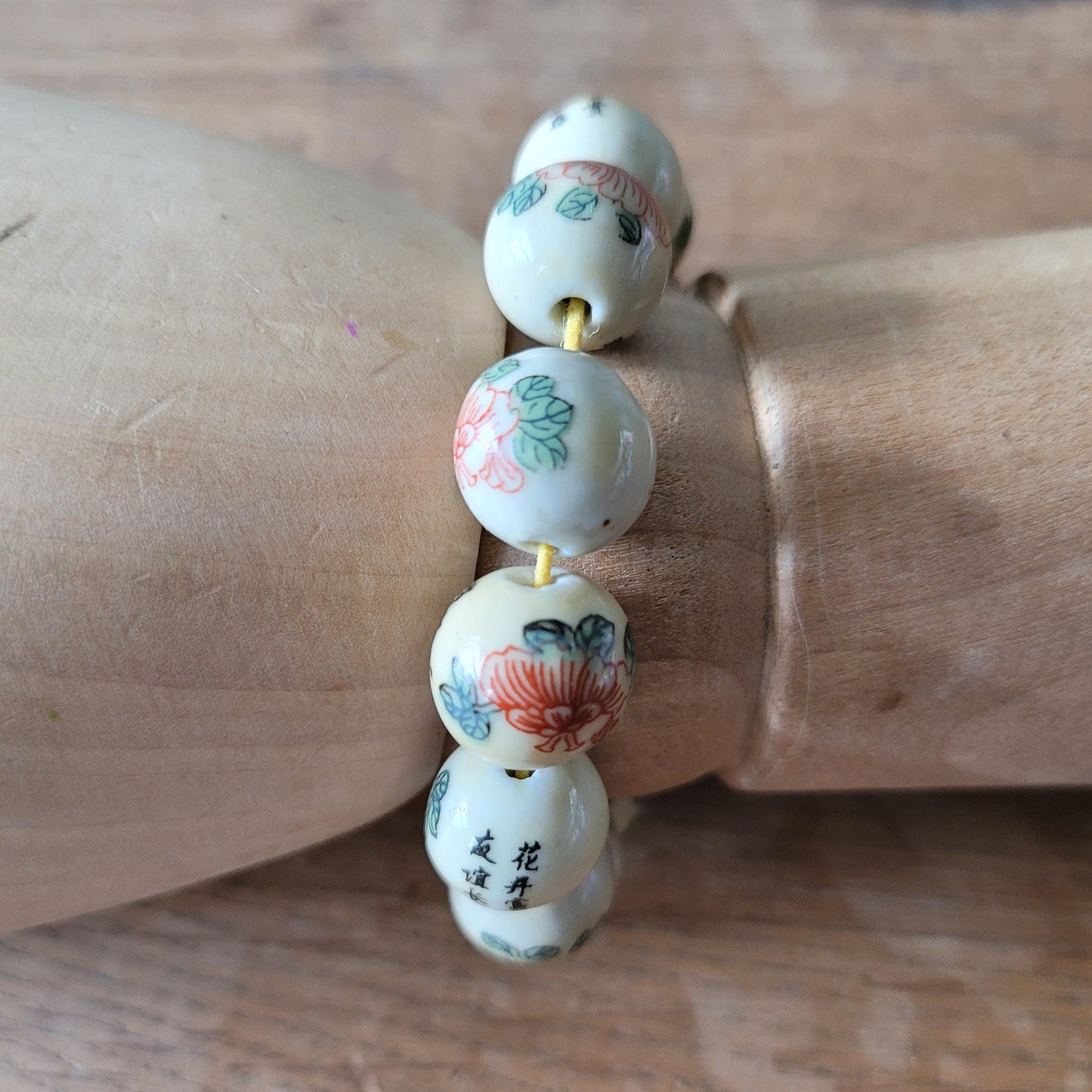 Vintage Chinese-style ceramic bead bracelet with floral motif and calligraphy detail