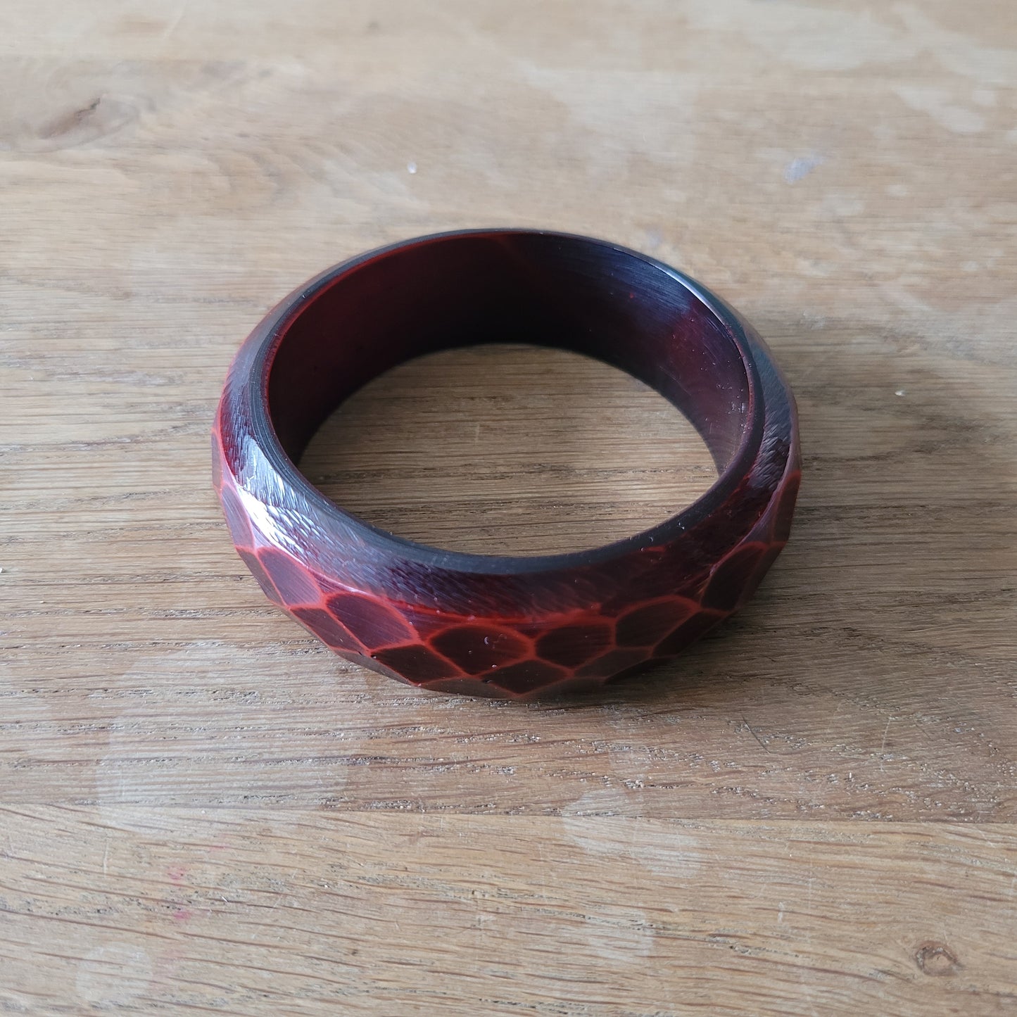 1970s deep red carved lucite faceted bangle