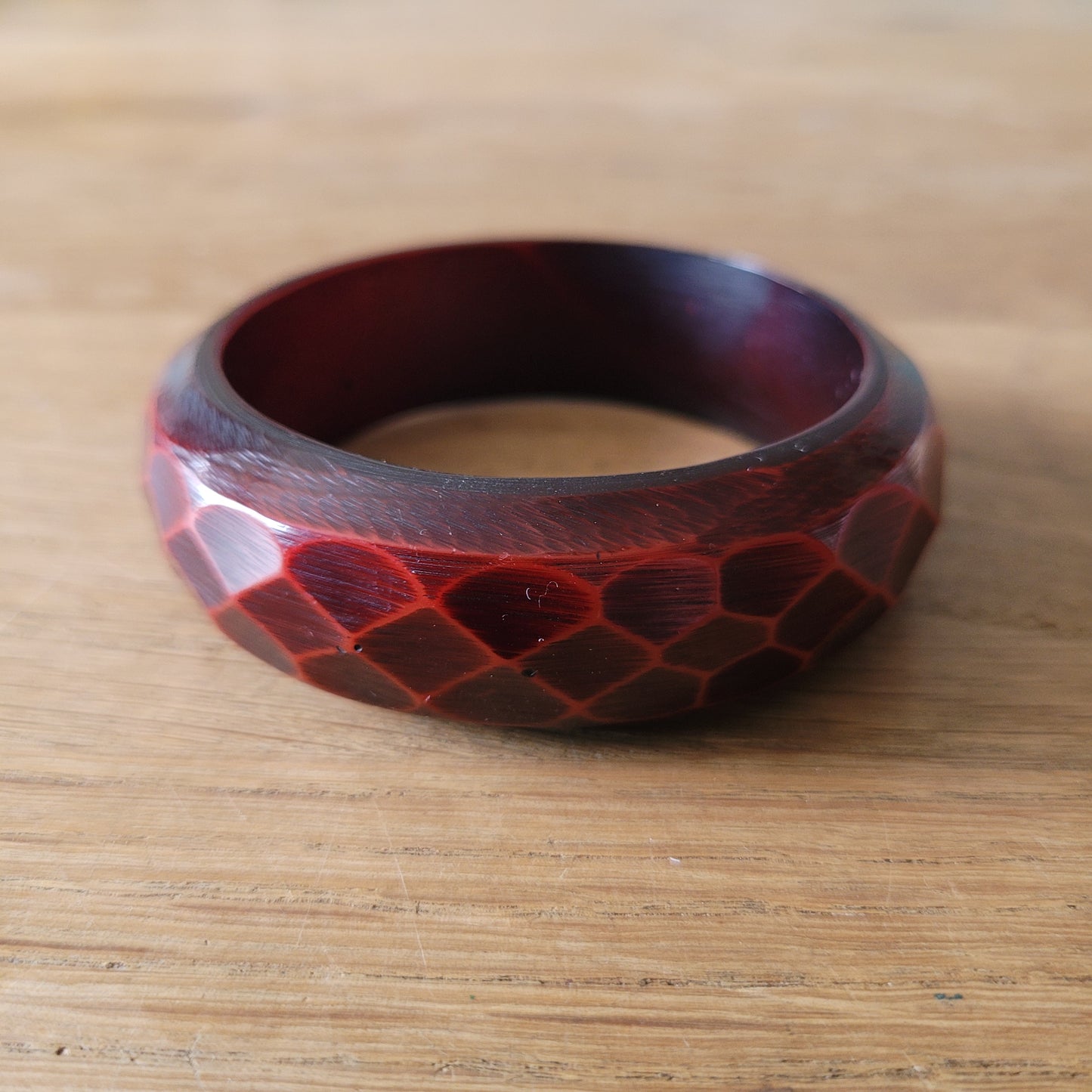1970s deep red carved lucite faceted bangle