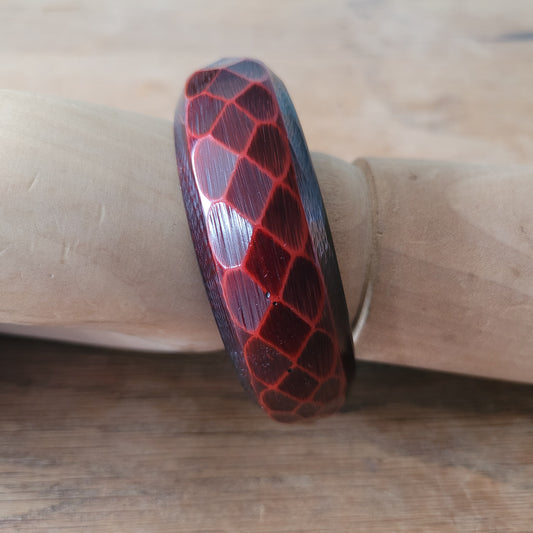 1970s deep red carved lucite faceted bangle