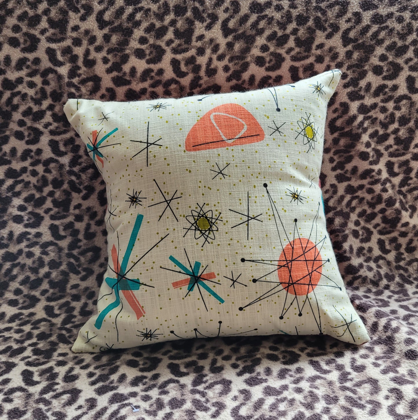 Home-made 1950s-inspired Atomic Starburst pattern cushion cover with contrast green OR rust reverse