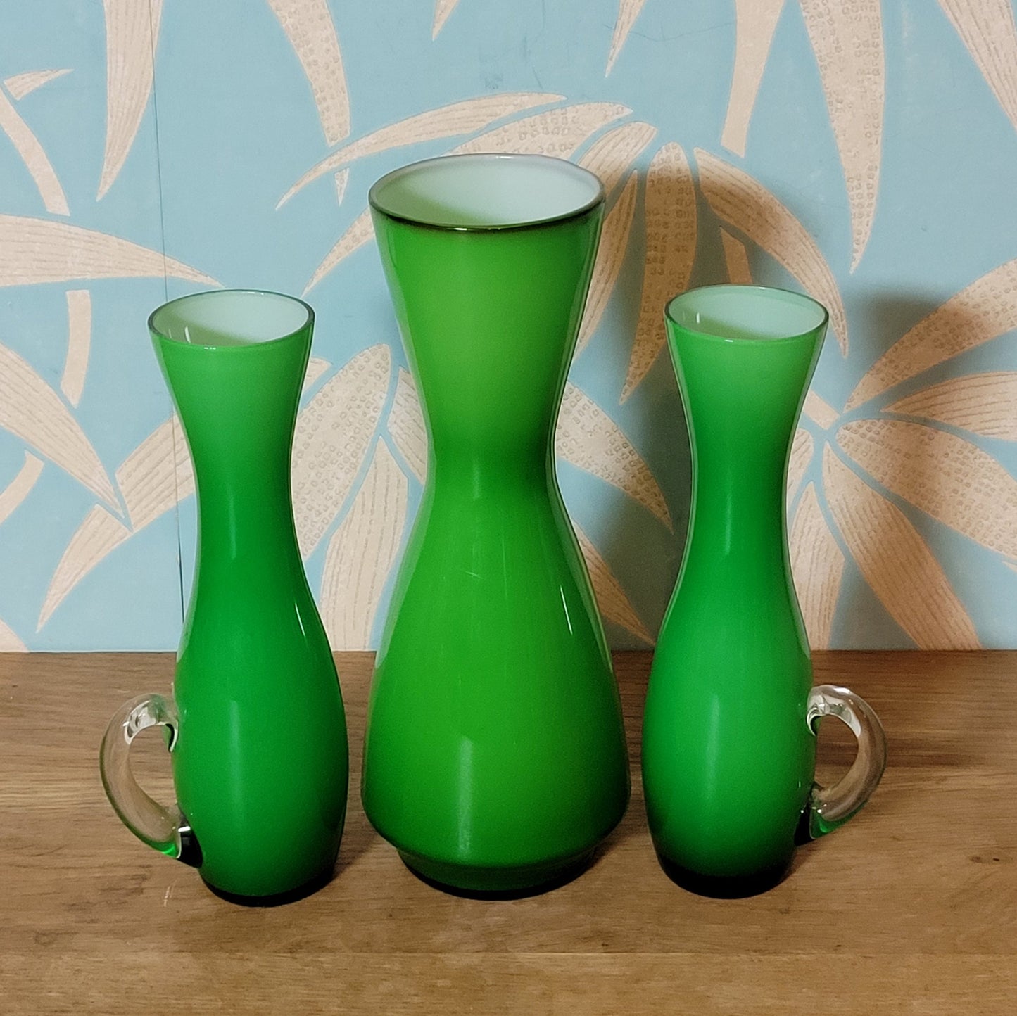 Set of three 1960s/70s Scandinavian-style green cased glass waisted vases