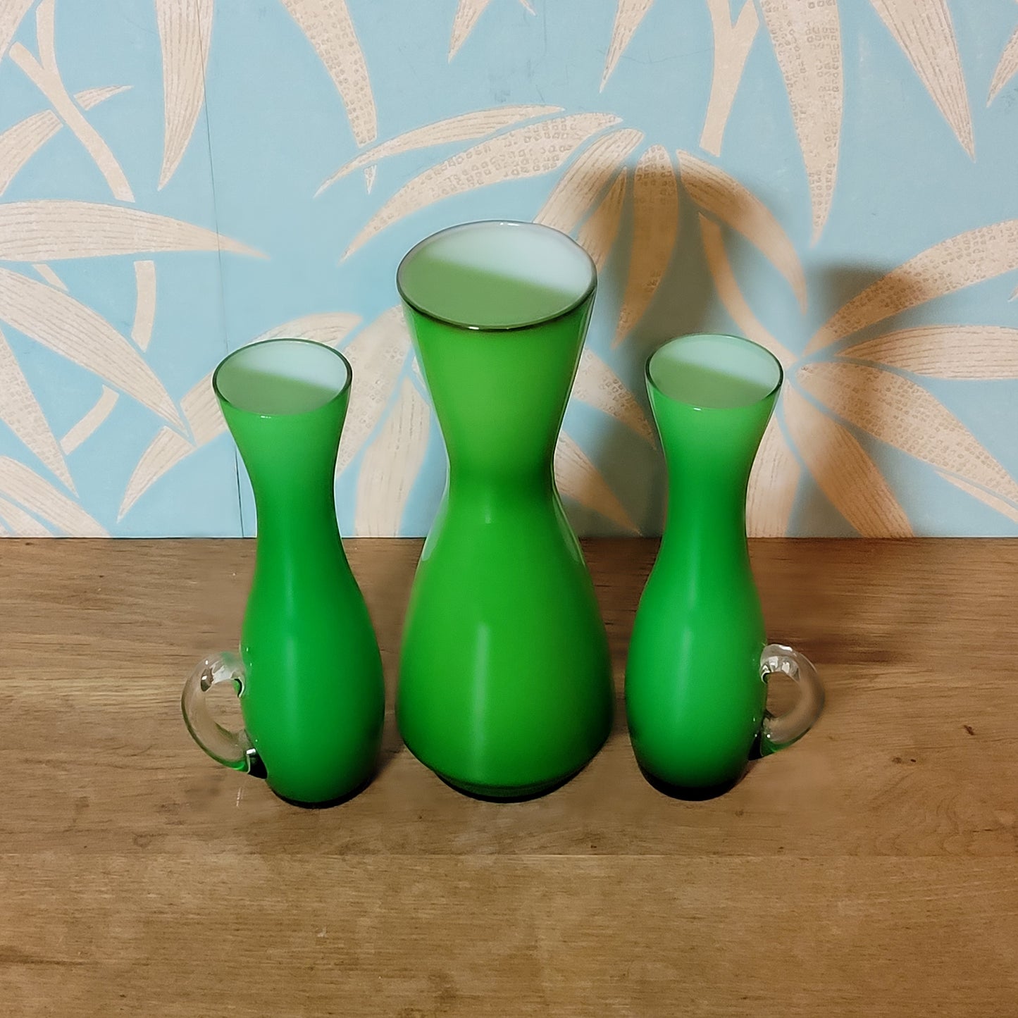 Set of three 1960s/70s Scandinavian-style green cased glass waisted vases
