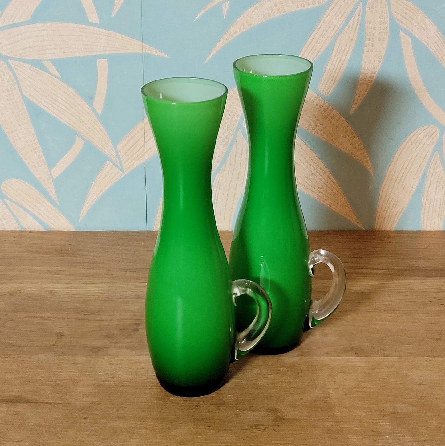 Set of three 1960s/70s Scandinavian-style green cased glass waisted vases