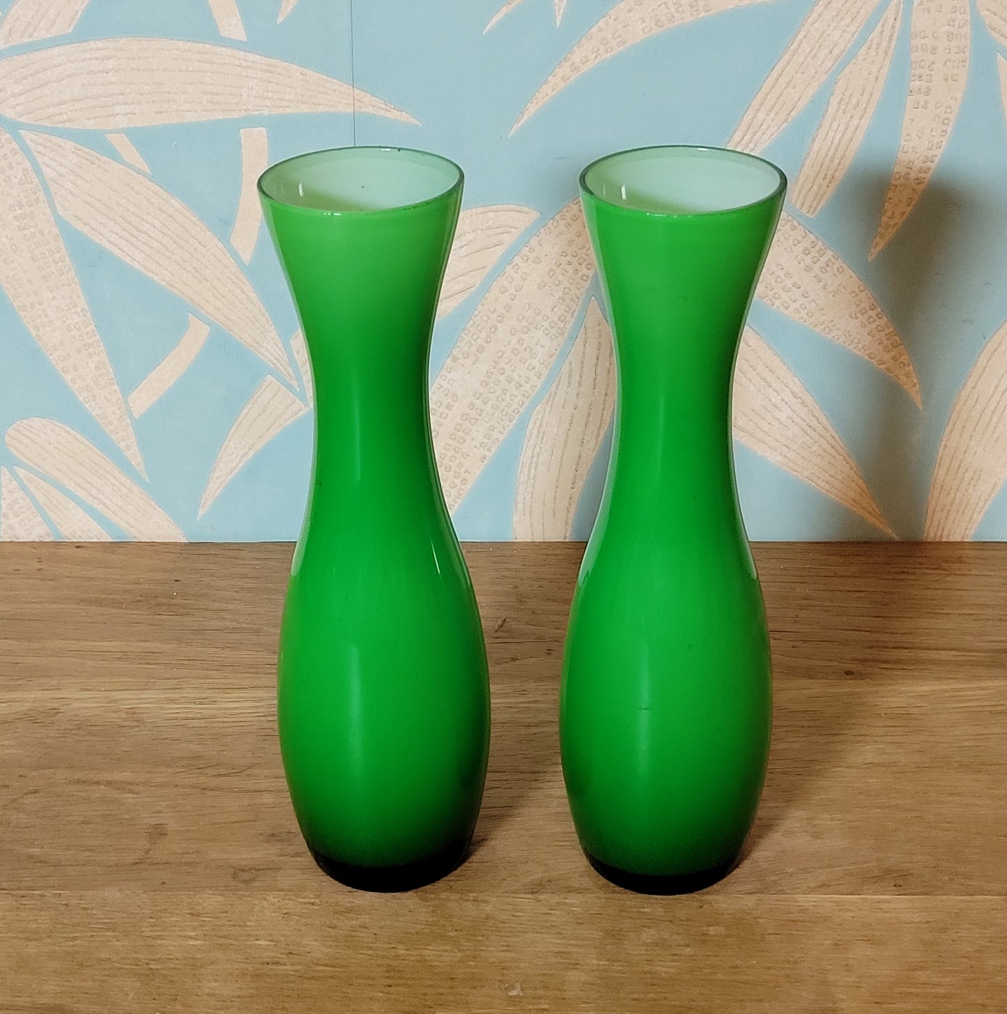 Set of three 1960s/70s Scandinavian-style green cased glass waisted vases