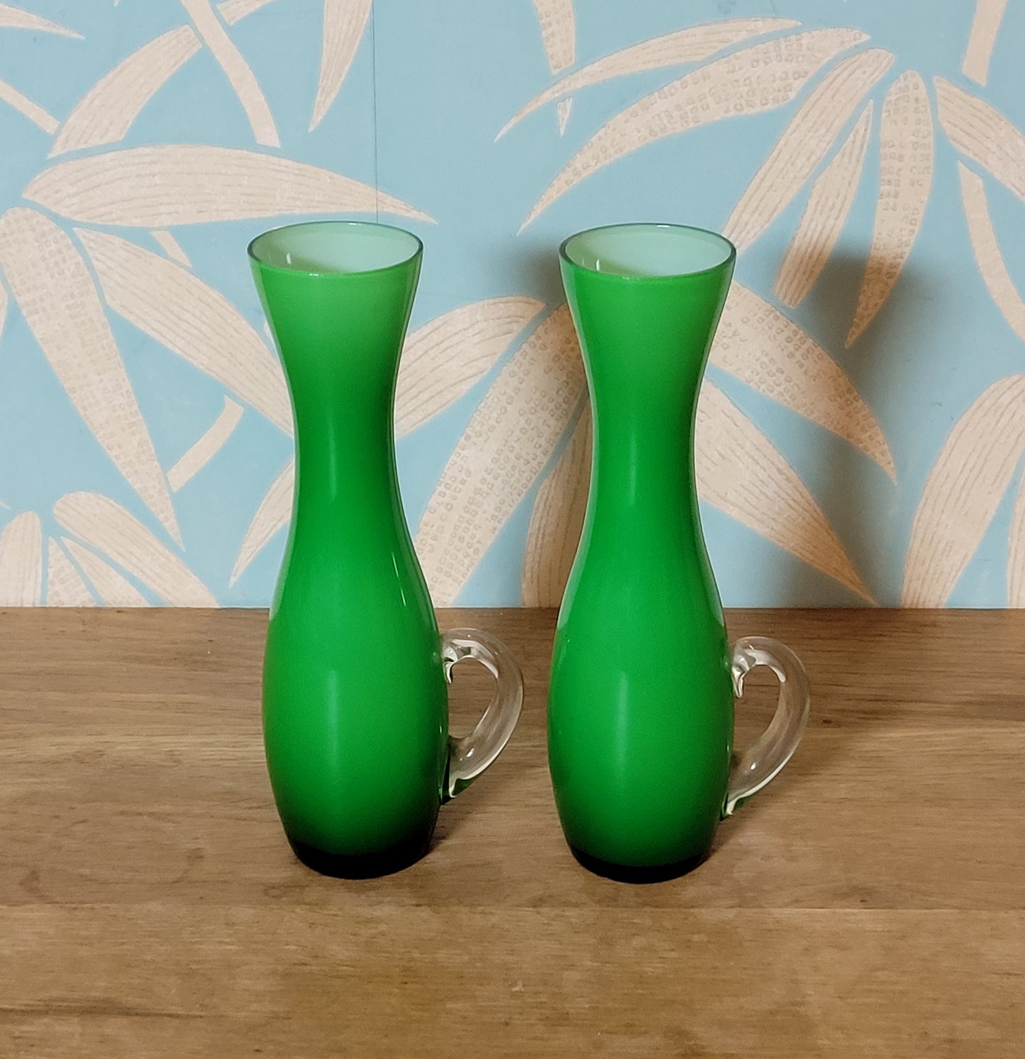 Set of three 1960s/70s Scandinavian-style green cased glass waisted vases