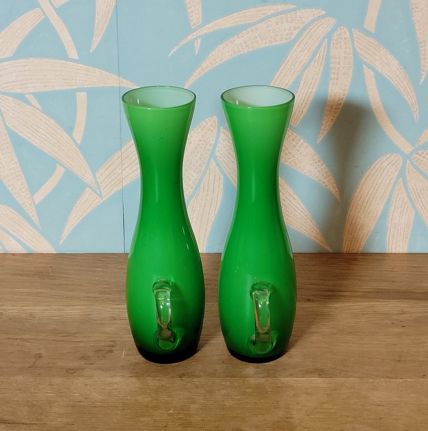 Set of three 1960s/70s Scandinavian-style green cased glass waisted vases