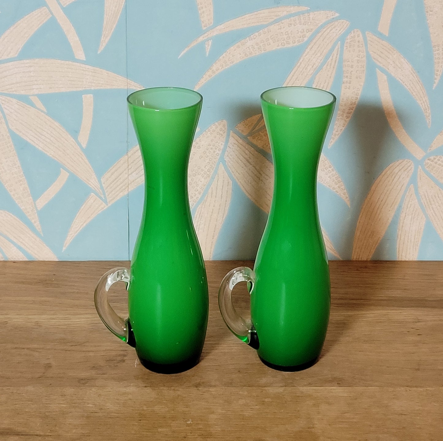 Set of three 1960s/70s Scandinavian-style green cased glass waisted vases