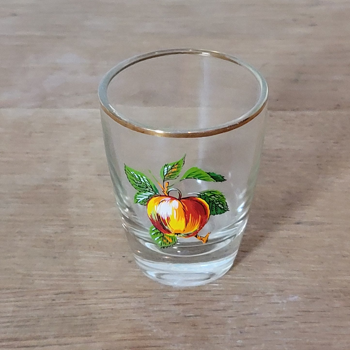 Set of five 1970s fruit patterned shot glasses with gilt trim