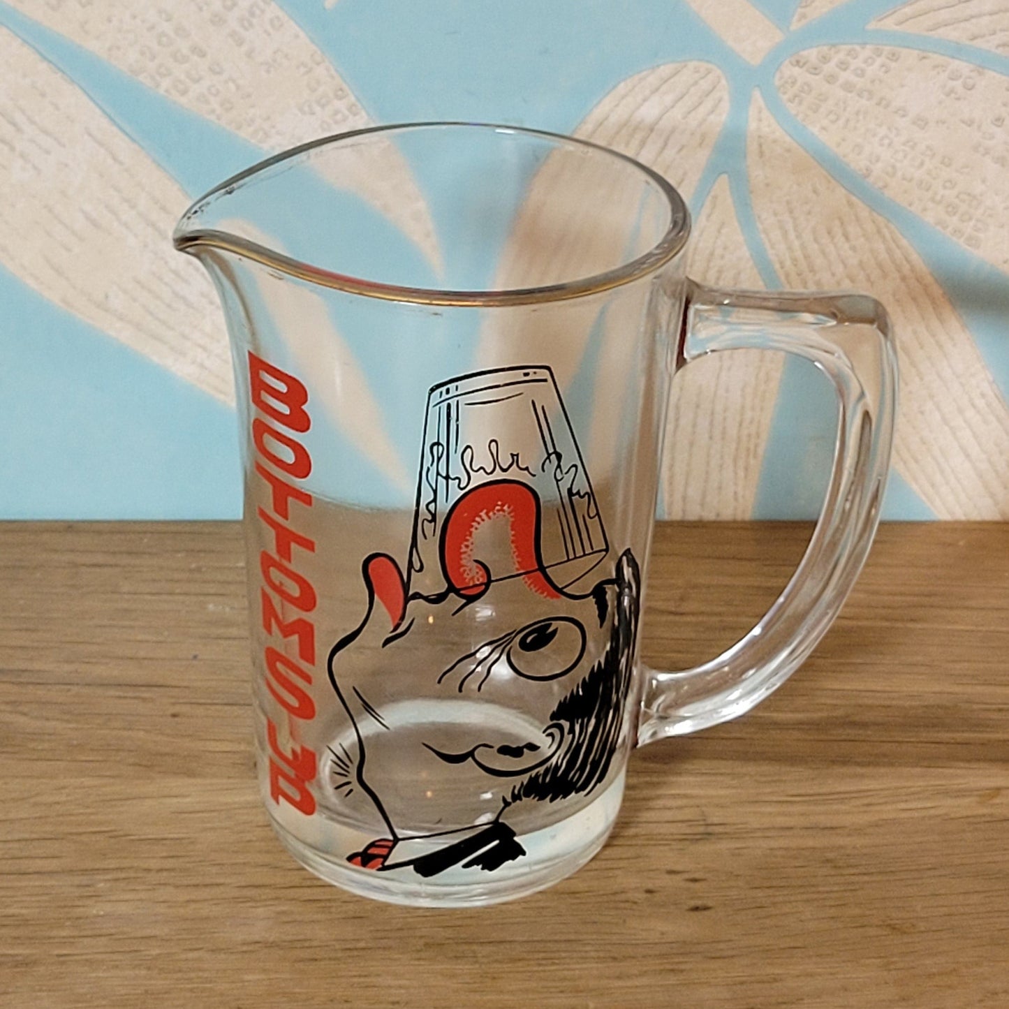 Mid-century ‘Bottoms Up’ glass cocktail mixer jug with drunken man design