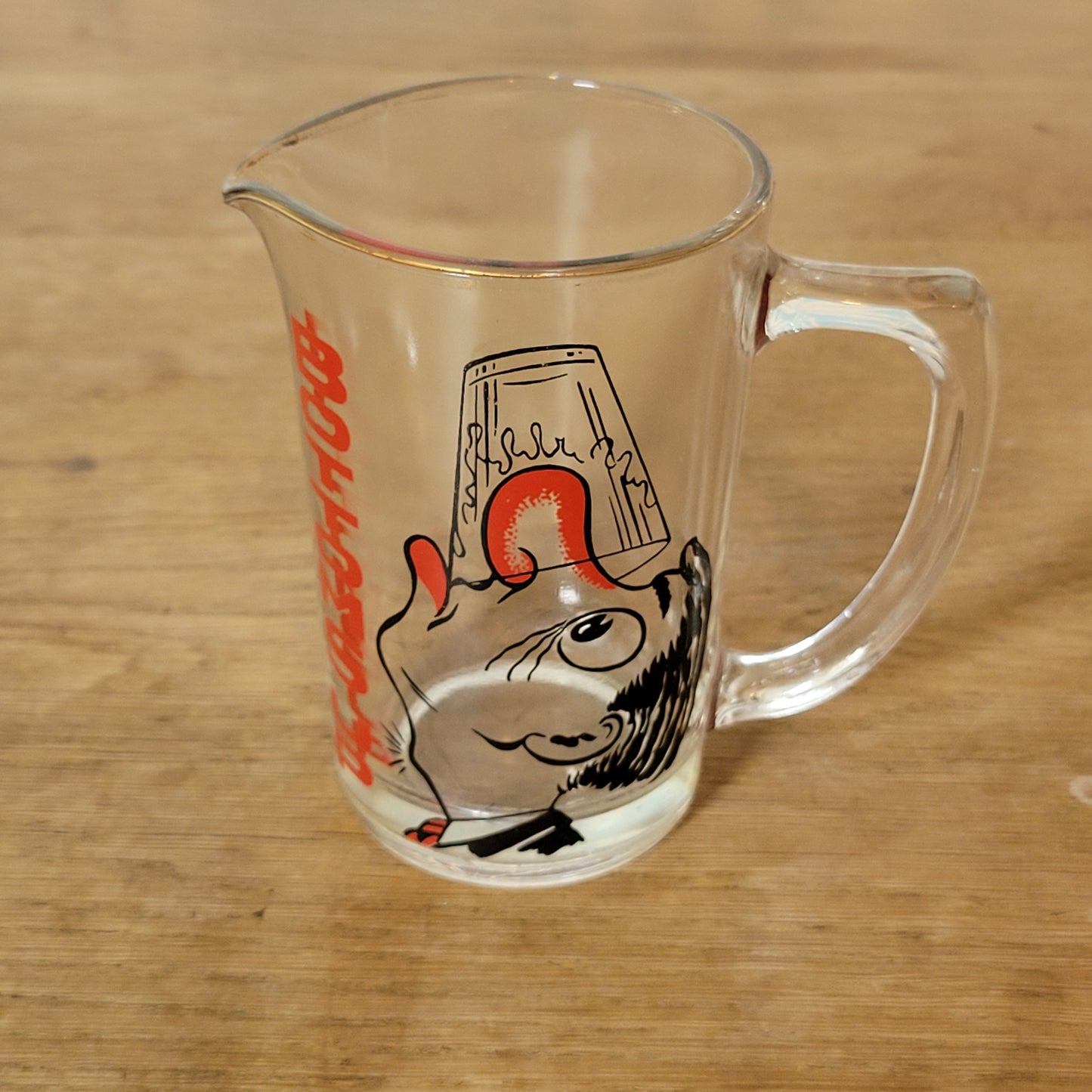 Mid-century ‘Bottoms Up’ glass cocktail mixer jug with drunken man design