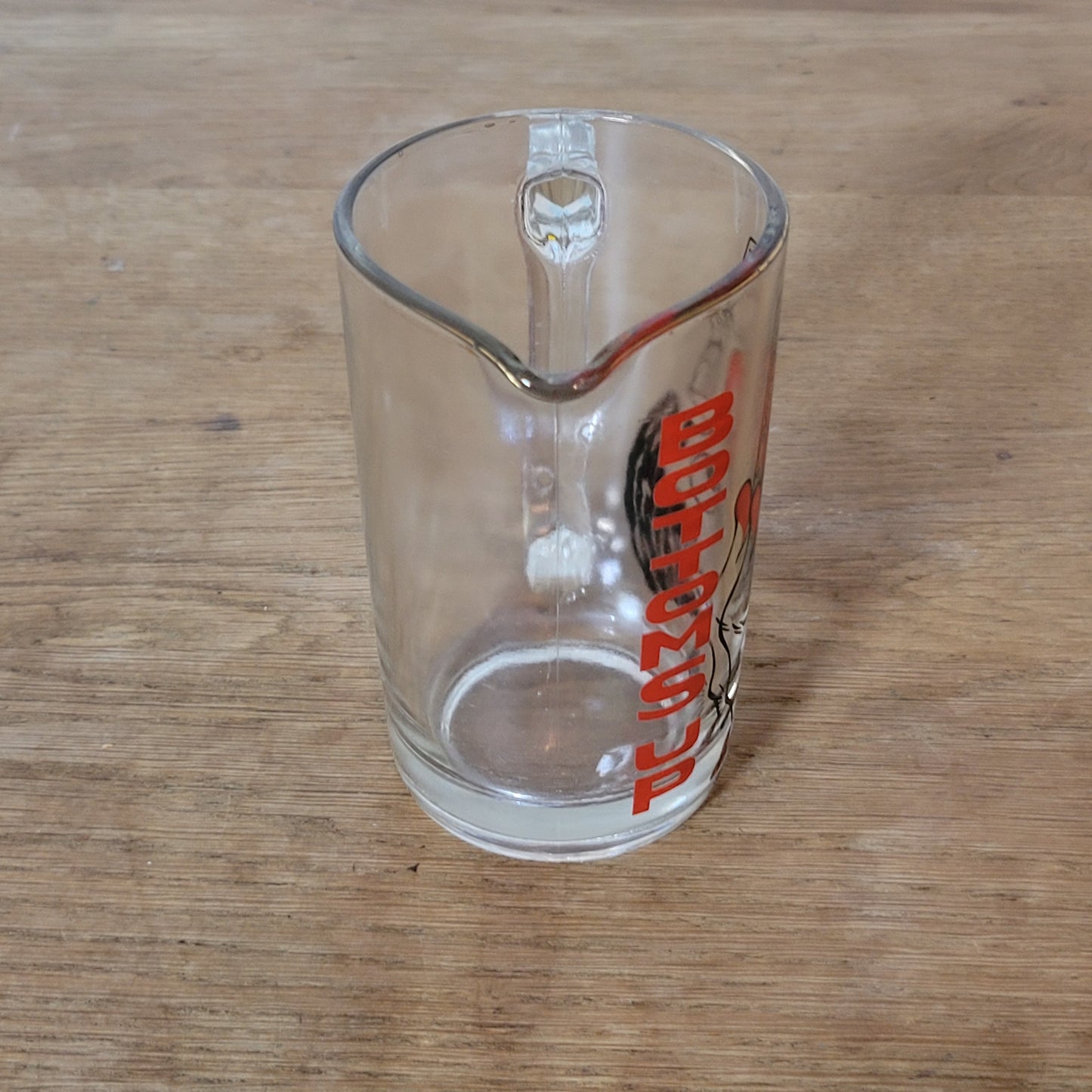 Mid-century ‘Bottoms Up’ glass cocktail mixer jug with drunken man design