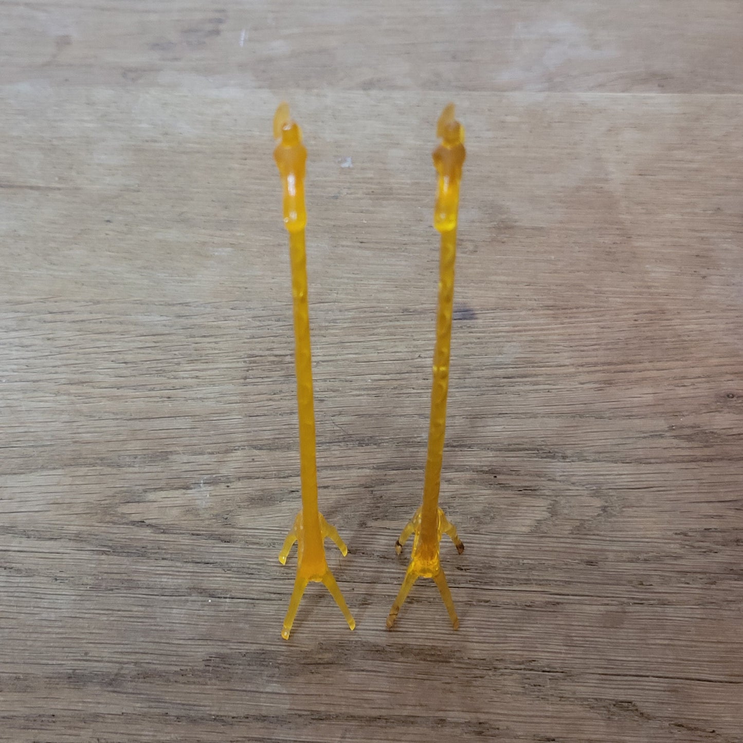 Pair of 1960s orange plastic giraffe swizzle sticks