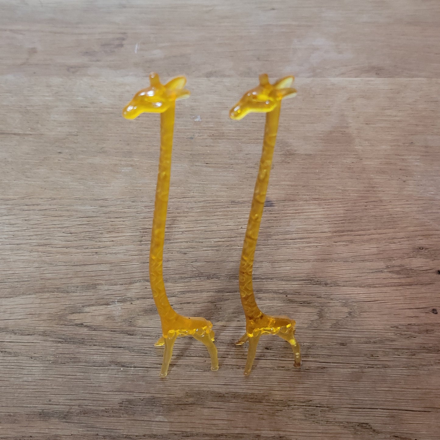 Pair of 1960s orange plastic giraffe swizzle sticks