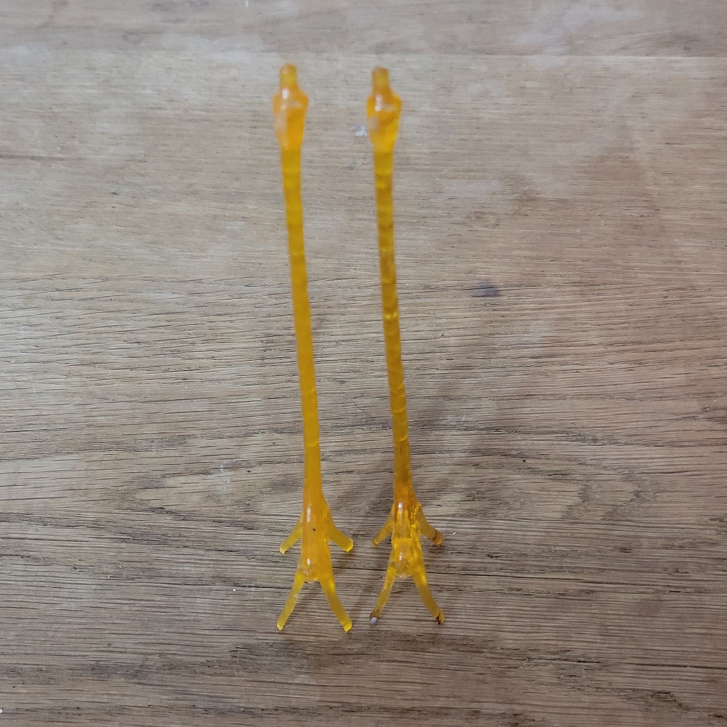 Pair of 1960s orange plastic giraffe swizzle sticks