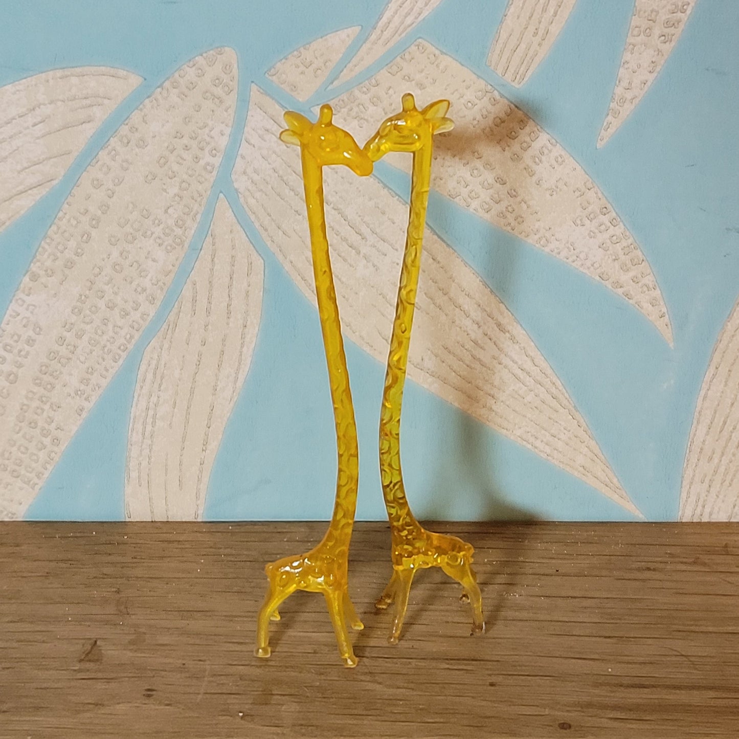 Pair of 1960s orange plastic giraffe swizzle sticks