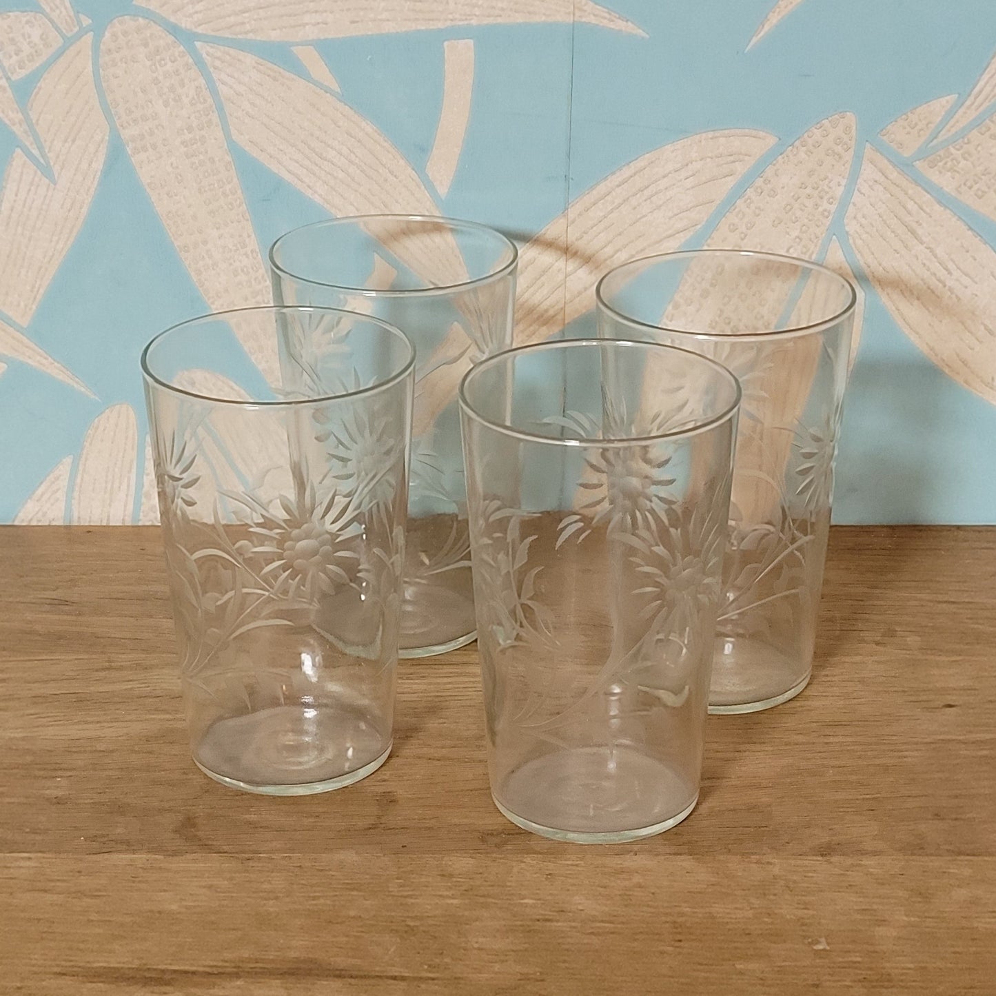 Set of four 1950s cut glass tumblers with floral chrysanthemum motif