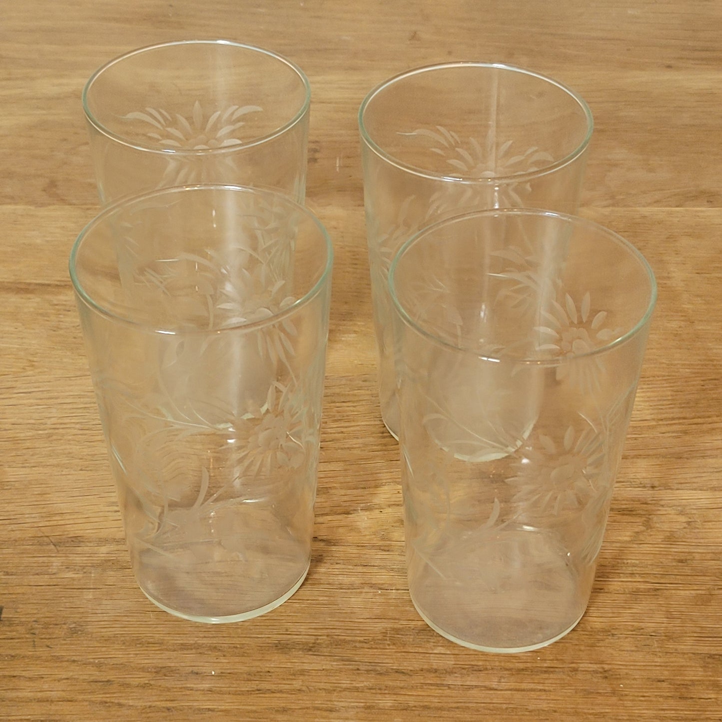 Set of four 1950s cut glass tumblers with floral chrysanthemum motif