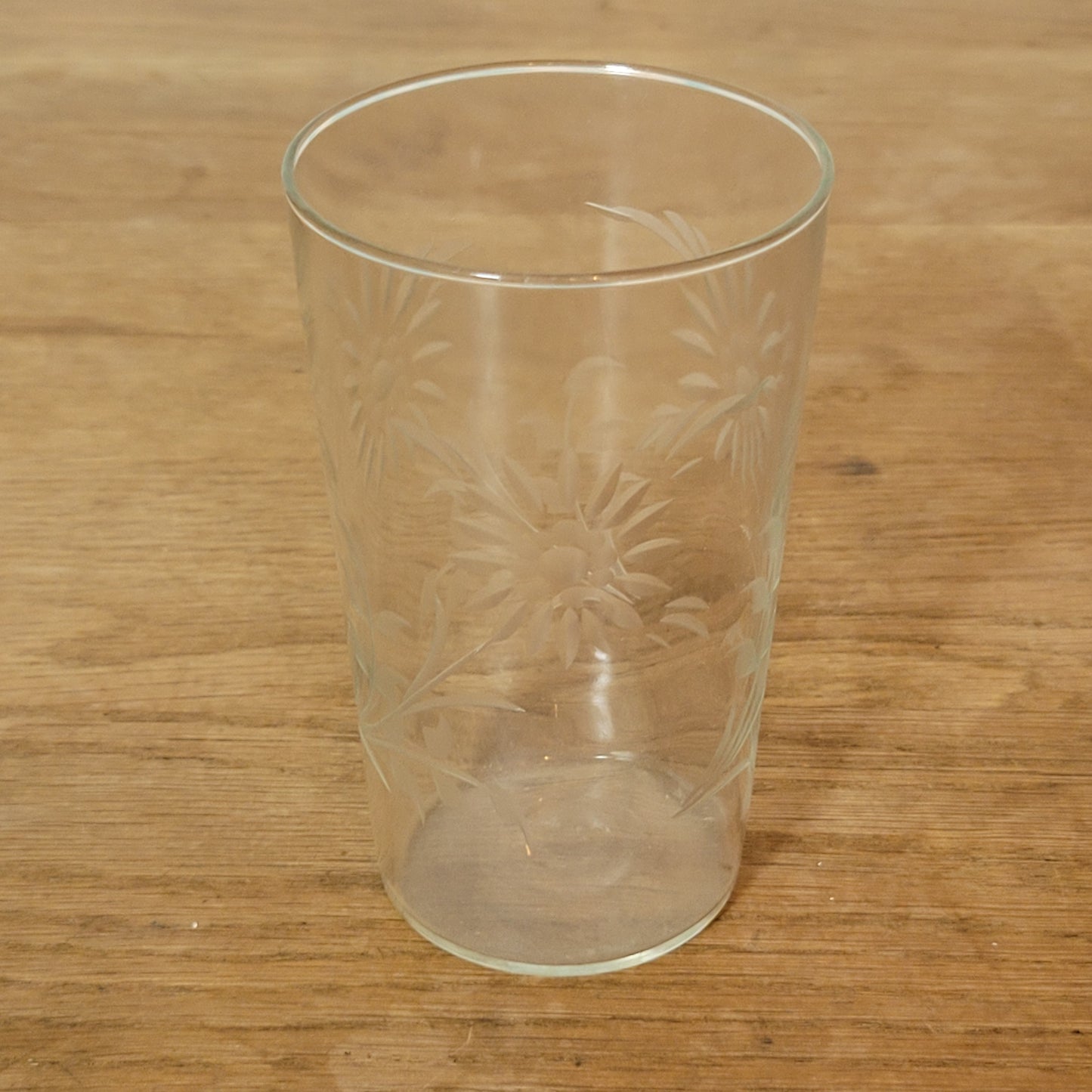 Set of four 1950s cut glass tumblers with floral chrysanthemum motif