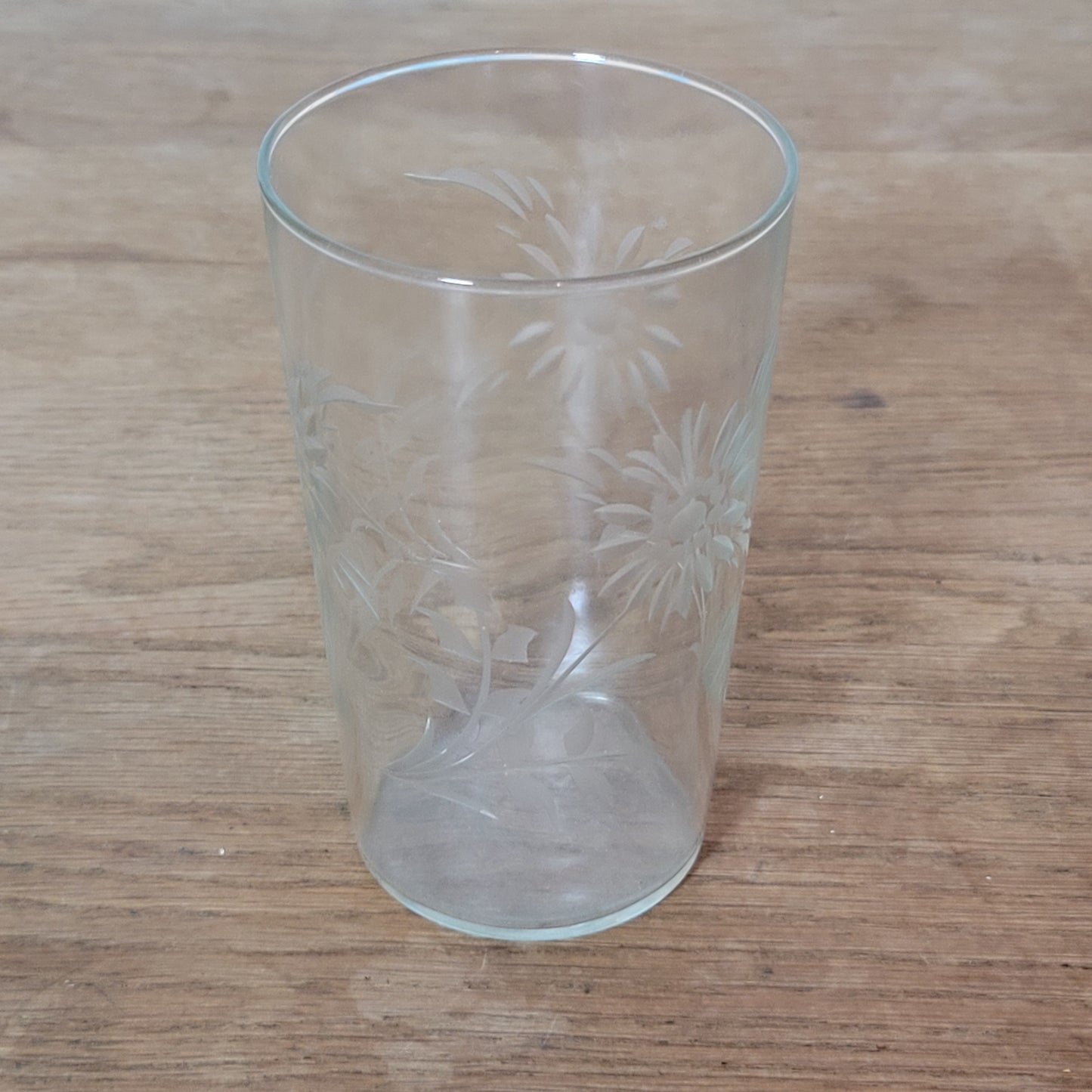 Set of four 1950s cut glass tumblers with floral chrysanthemum motif