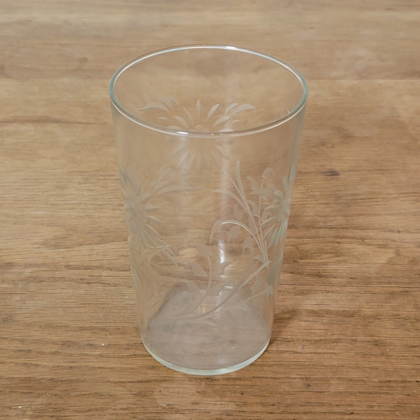 Set of four 1950s cut glass tumblers with floral chrysanthemum motif