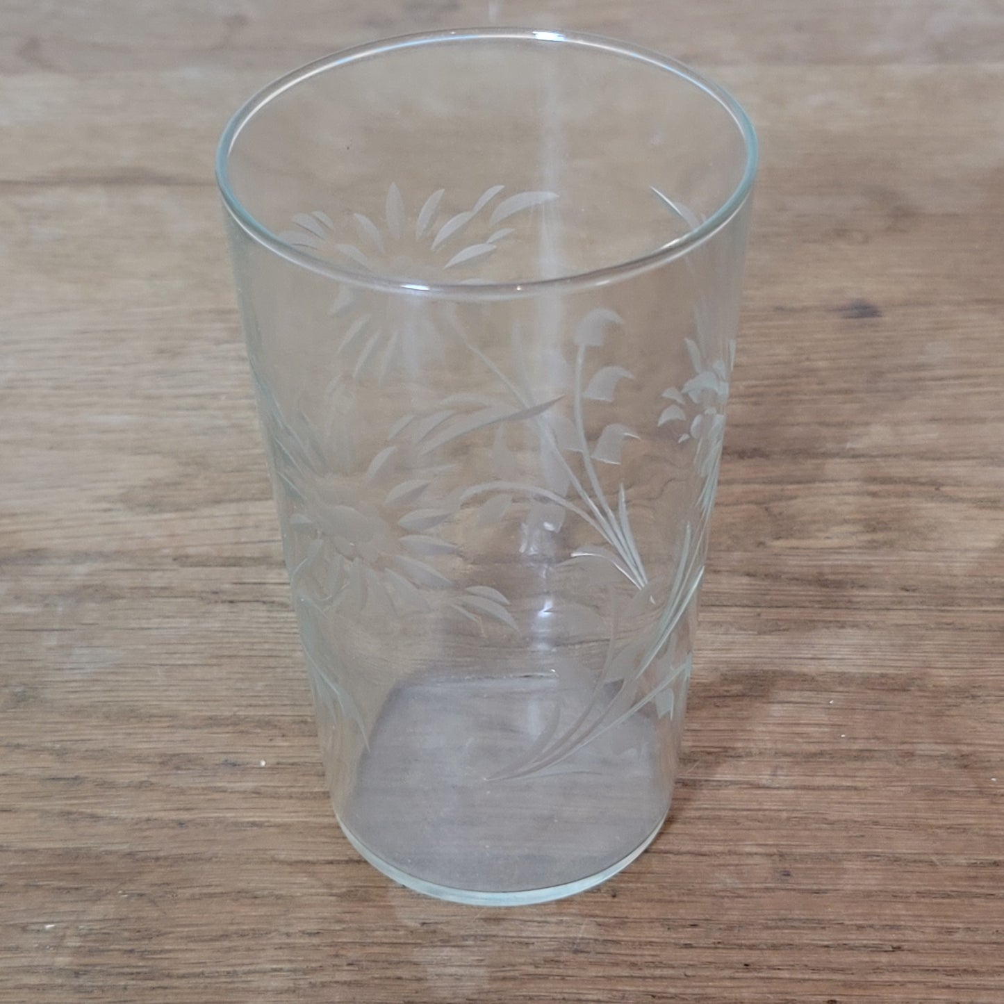 Set of four 1950s cut glass tumblers with floral chrysanthemum motif