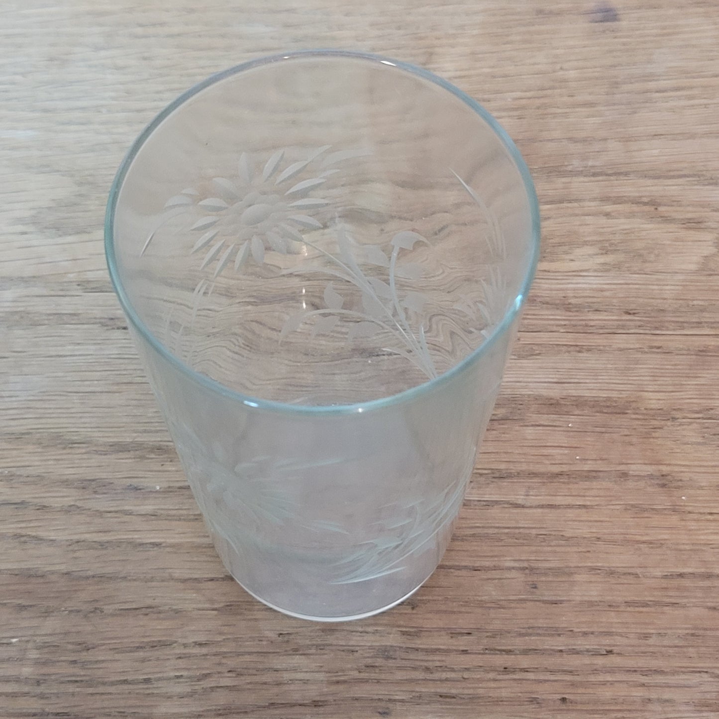 Set of four 1950s cut glass tumblers with floral chrysanthemum motif
