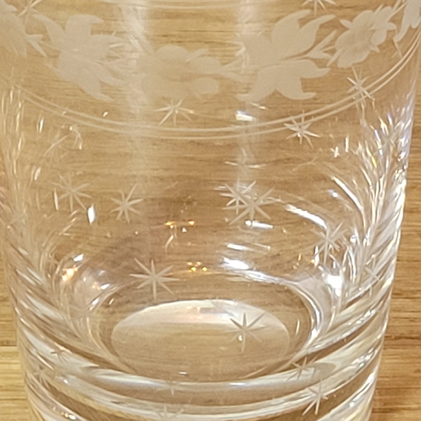 Set of 1950s cut glass tumblers and matching sherry glasses with floral and starburst design
