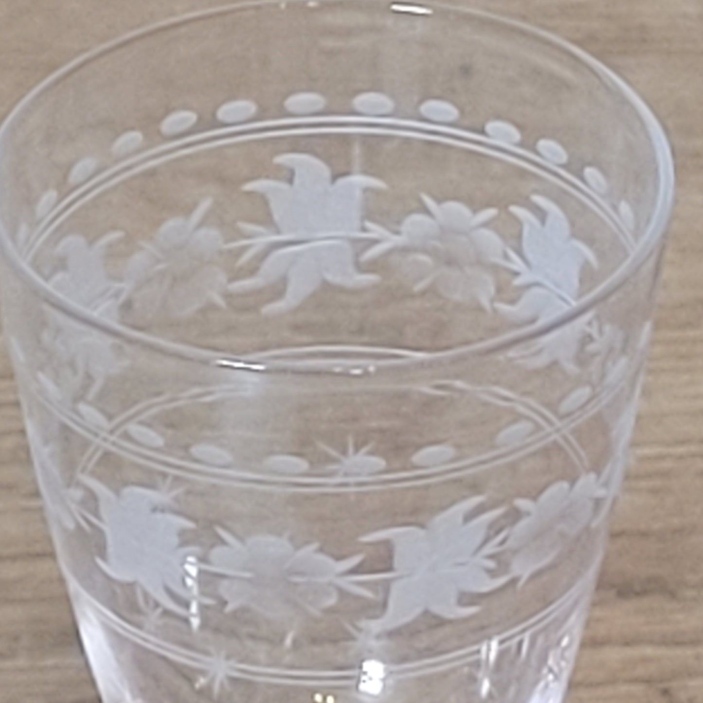Set of 1950s cut glass tumblers and matching sherry glasses with floral and starburst design