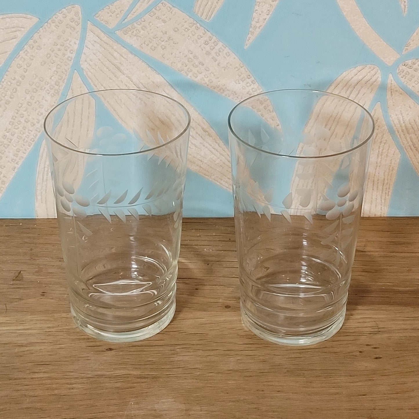 Pair of 1950s/60s cut glass water tumblers with leaf & berry design