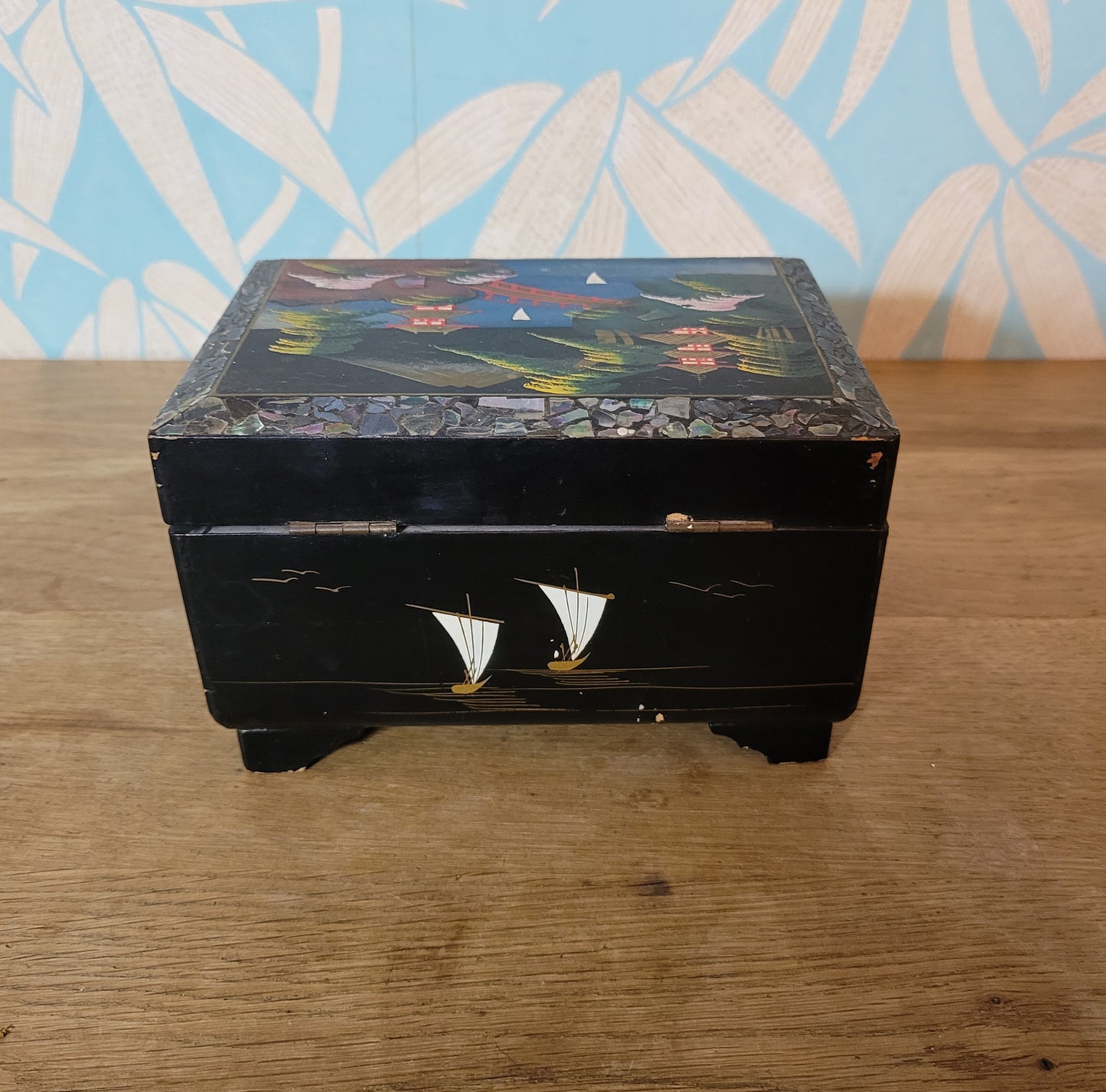 1950s black laquered Japanese multi-compartment musical jewellery box, with iternal hand-painted mirror