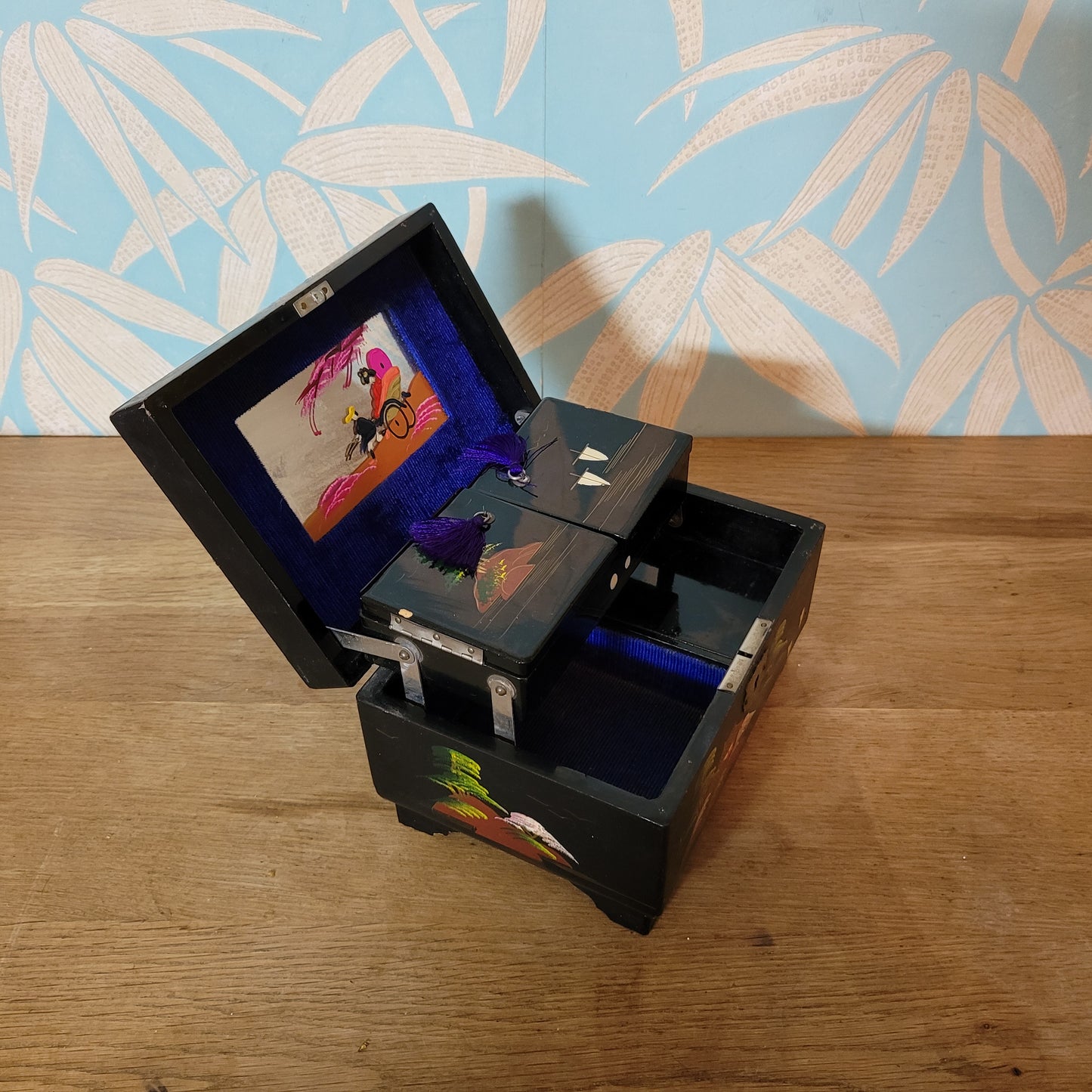 1950s black laquered Japanese multi-compartment musical jewellery box, with iternal hand-painted mirror