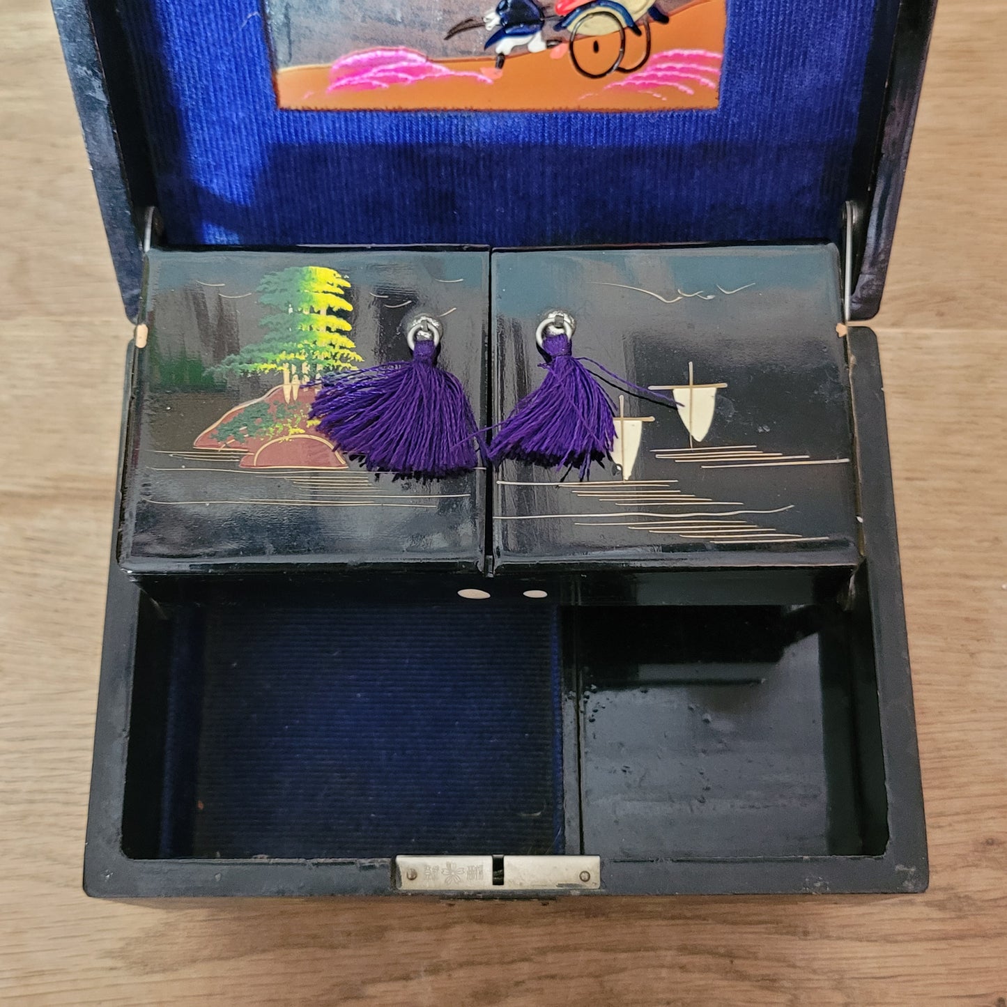 1950s black laquered Japanese multi-compartment musical jewellery box, with iternal hand-painted mirror