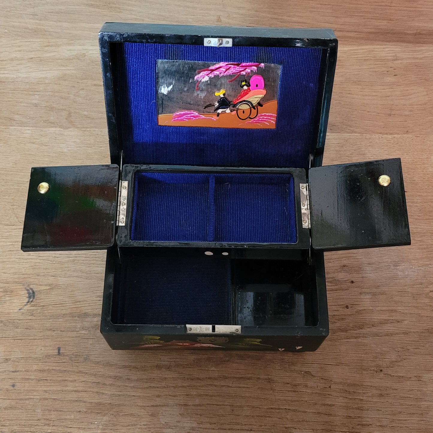 1950s black laquered Japanese multi-compartment musical jewellery box, with iternal hand-painted mirror