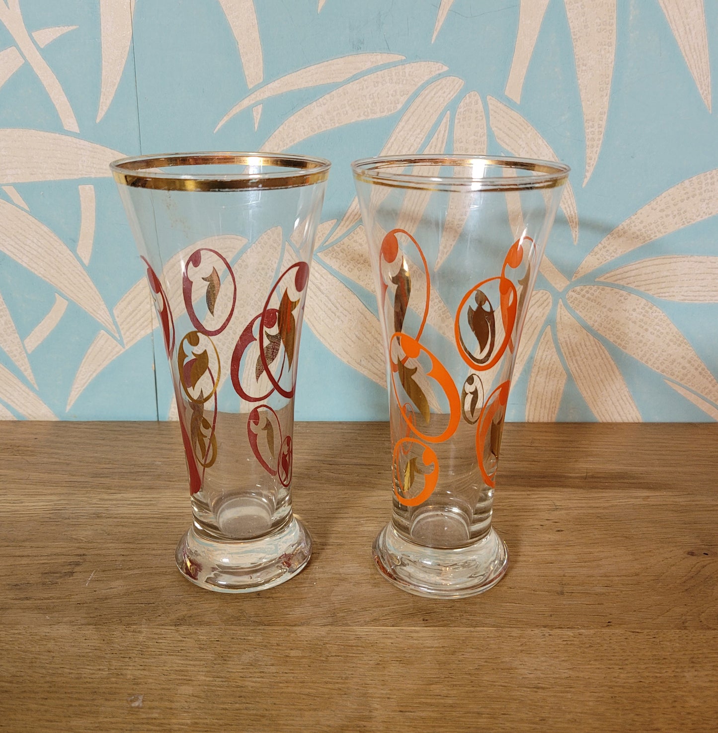 Pair of 1960s atomic swirl pilsner glasses with gilt detail
