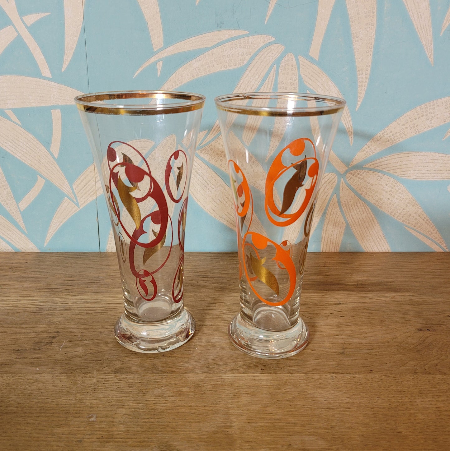 Pair of 1960s atomic swirl pilsner glasses with gilt detail