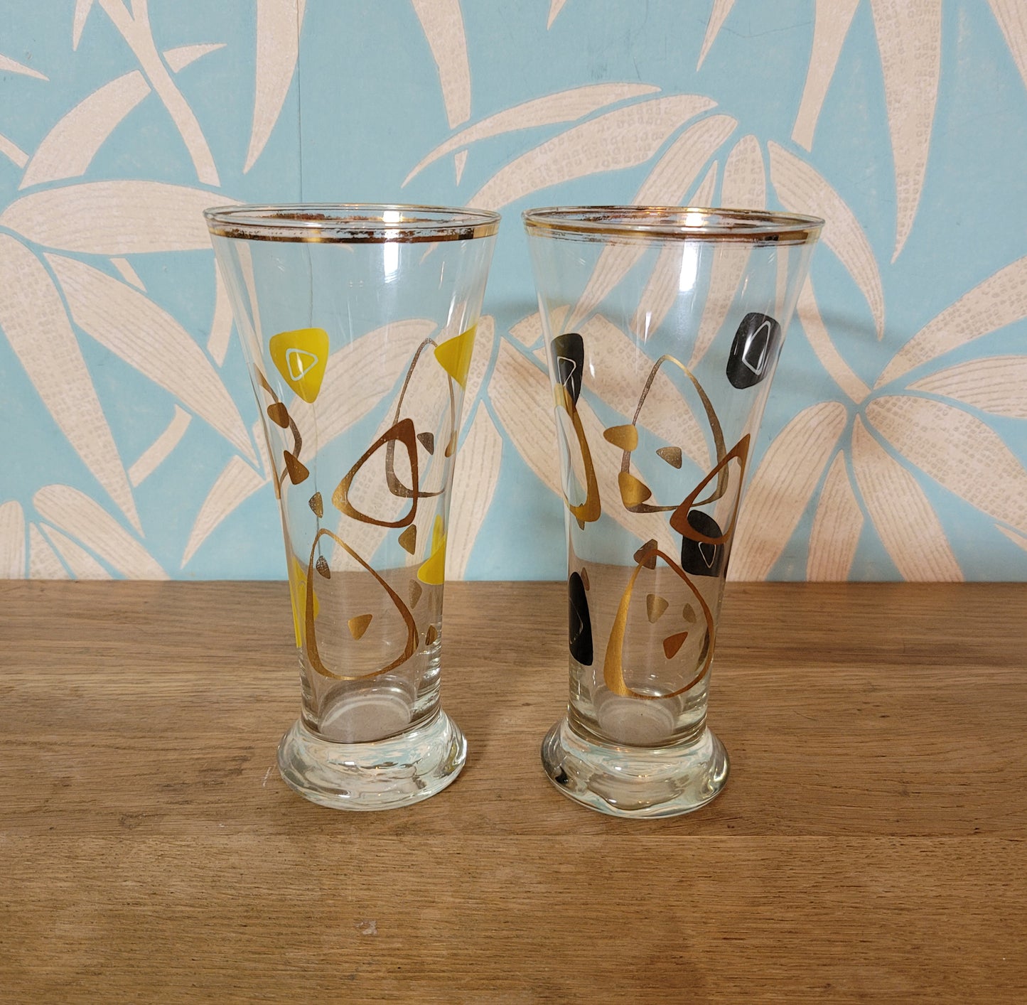 Pair of 1960s atomic boomerang pilsner glasses with gilt detail