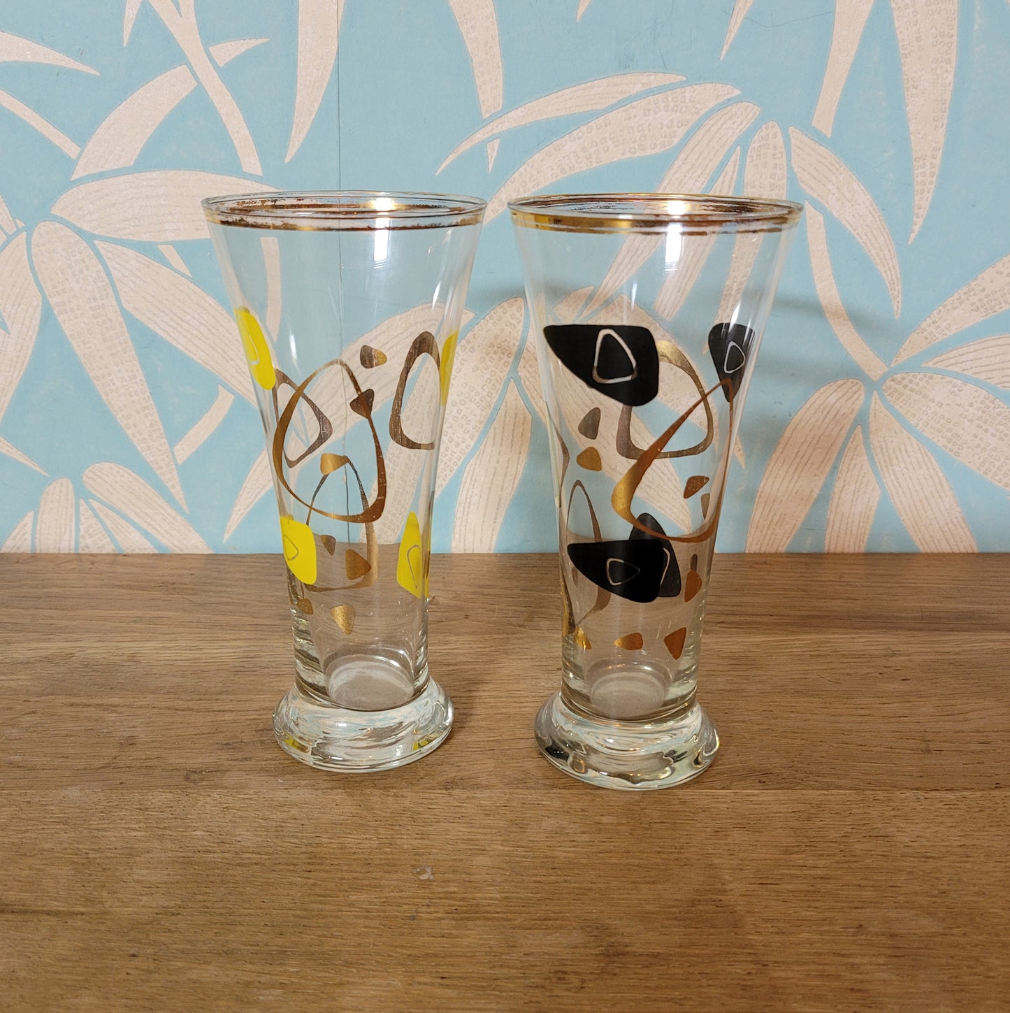 Pair of 1960s atomic boomerang pilsner glasses with gilt detail