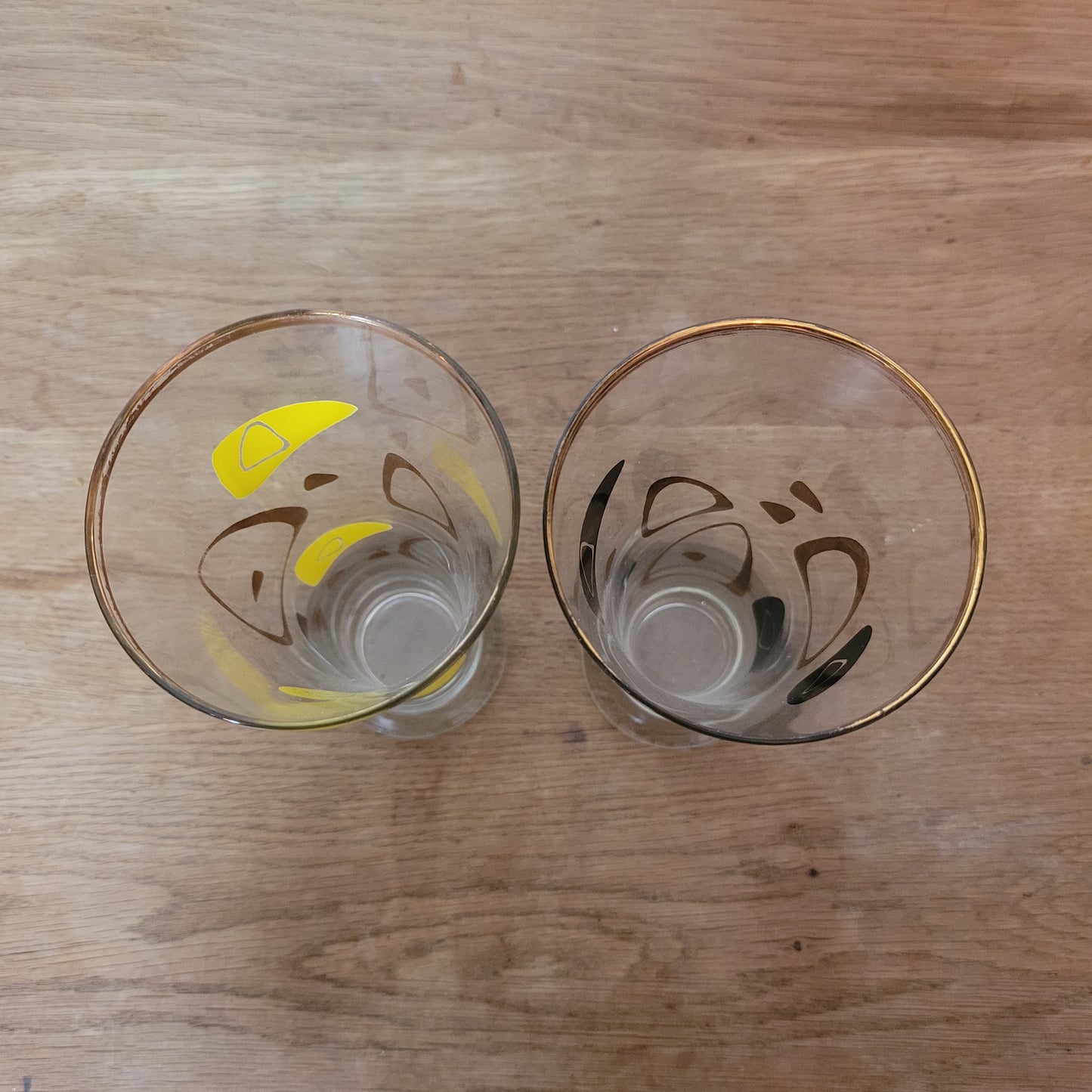 Pair of 1960s atomic boomerang pilsner glasses with gilt detail
