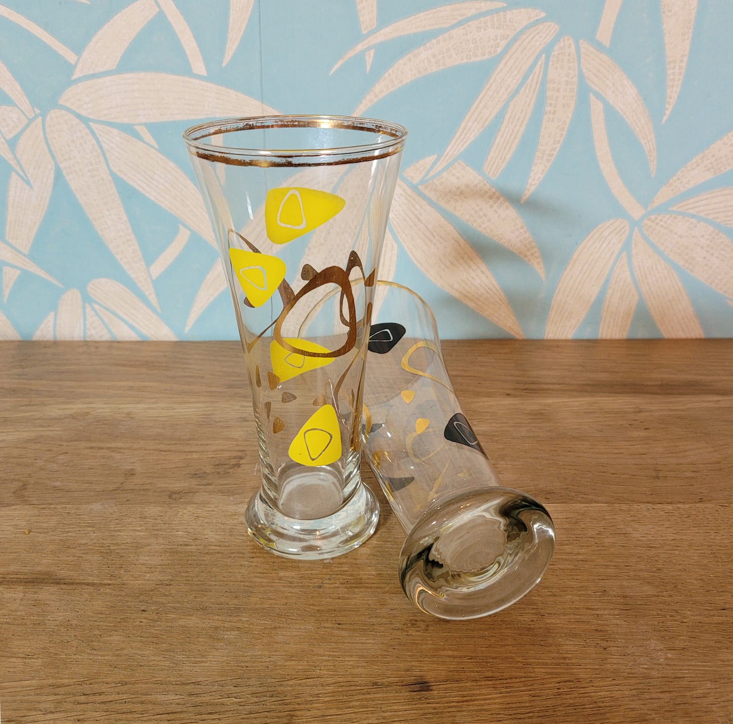 Pair of 1960s atomic boomerang pilsner glasses with gilt detail