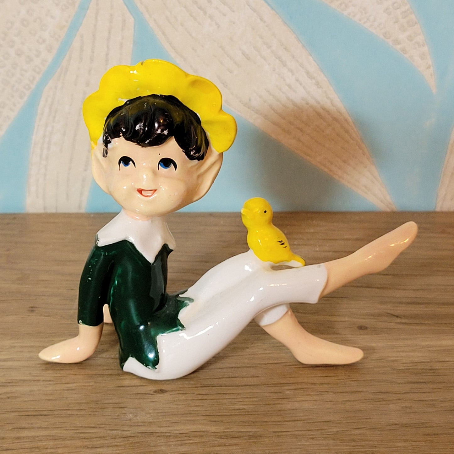 circa. 1960s ceramic pixie figurine with yellow bird