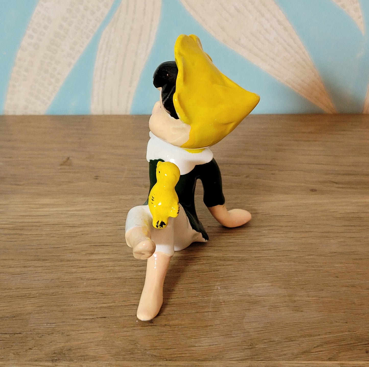 circa. 1960s ceramic pixie figurine with yellow bird