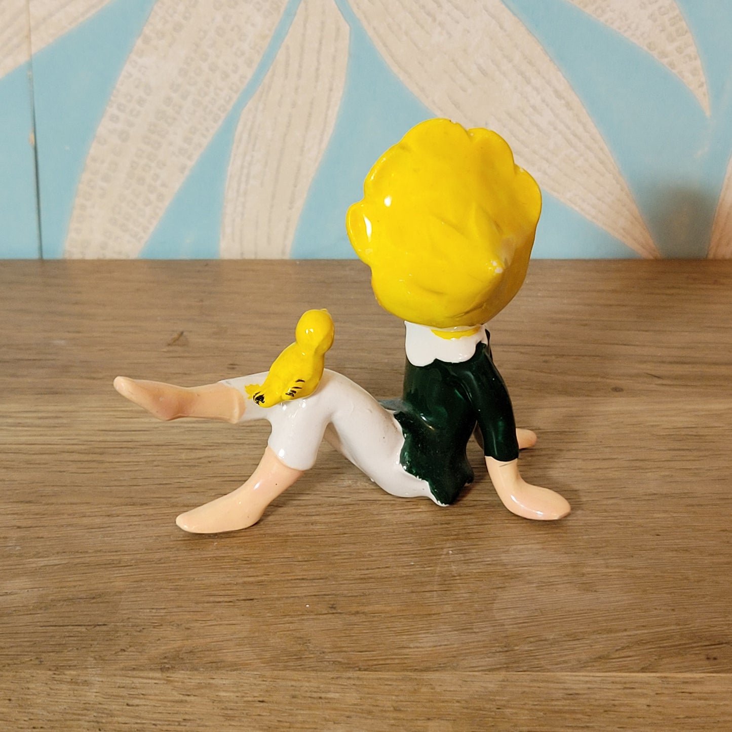 circa. 1960s ceramic pixie figurine with yellow bird