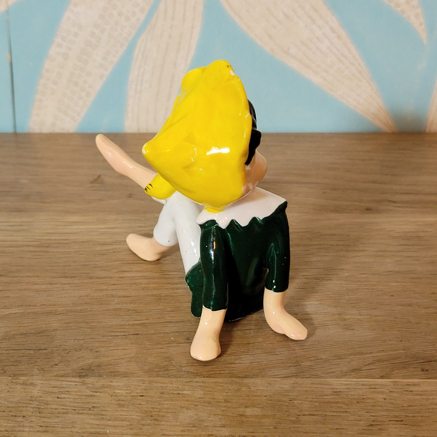 circa. 1960s ceramic pixie figurine with yellow bird