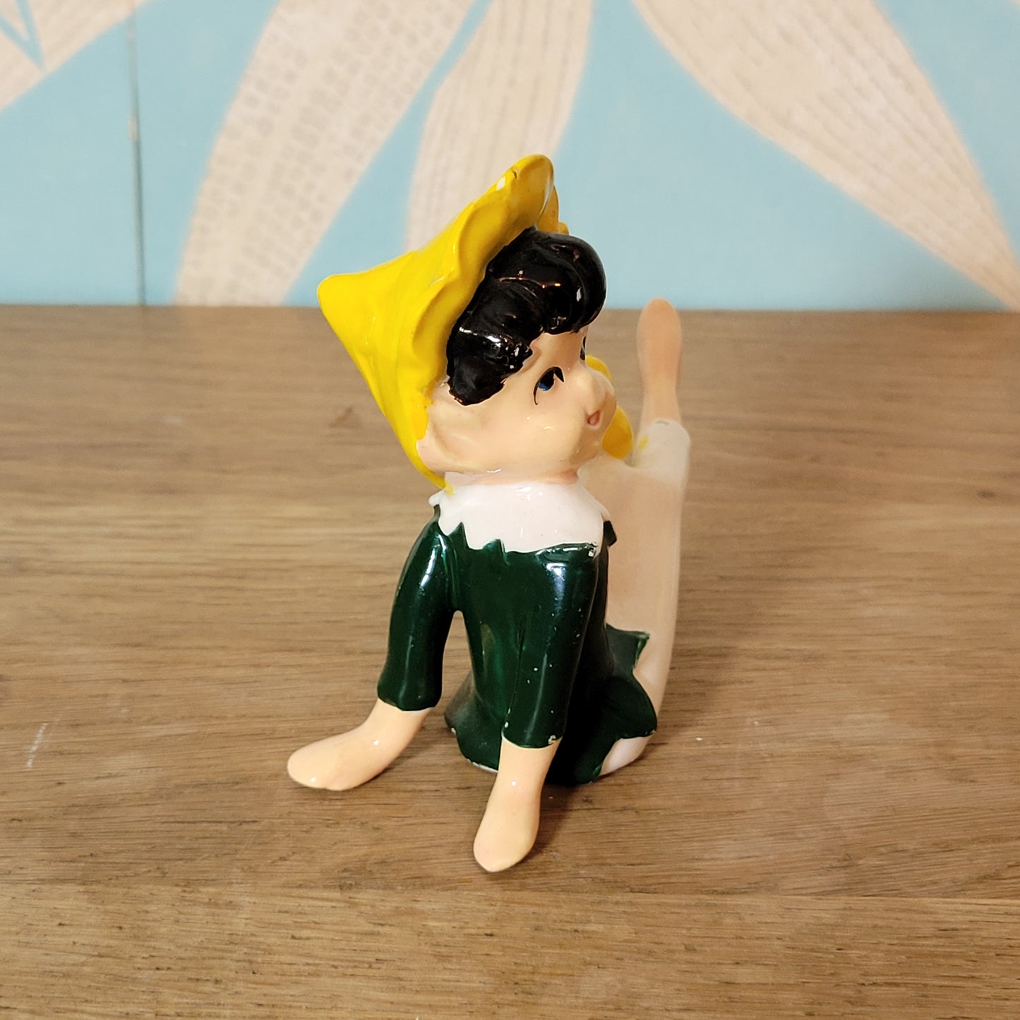 circa. 1960s ceramic pixie figurine with yellow bird