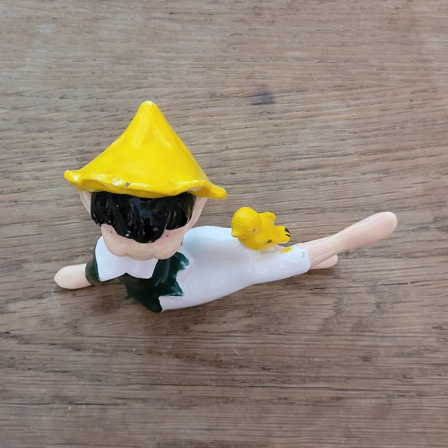 circa. 1960s ceramic pixie figurine with yellow bird