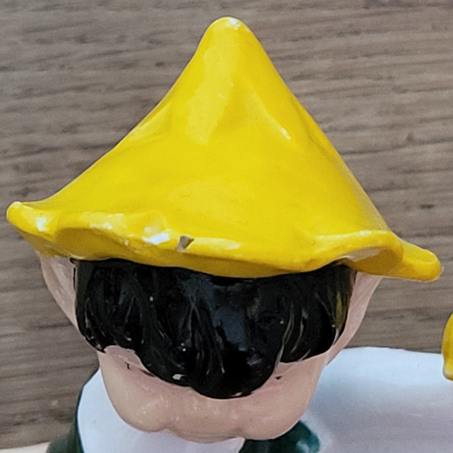 circa. 1960s ceramic pixie figurine with yellow bird
