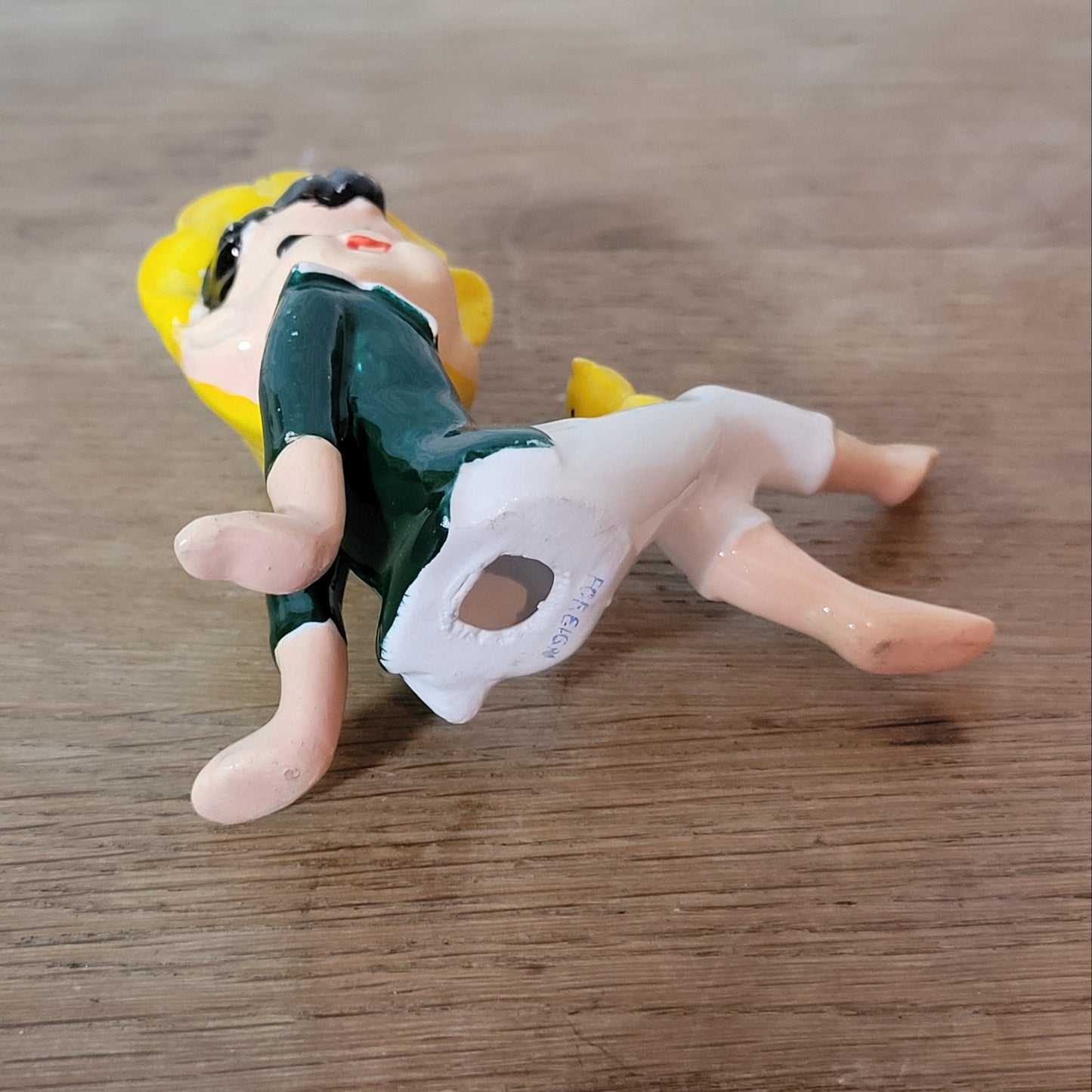 circa. 1960s ceramic pixie figurine with yellow bird