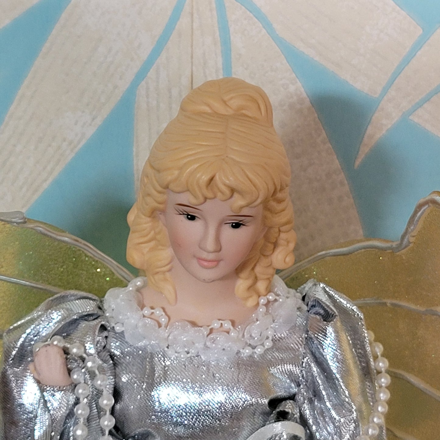 Vintage Christmas angel tree topper in silver dress with gold/silver wings